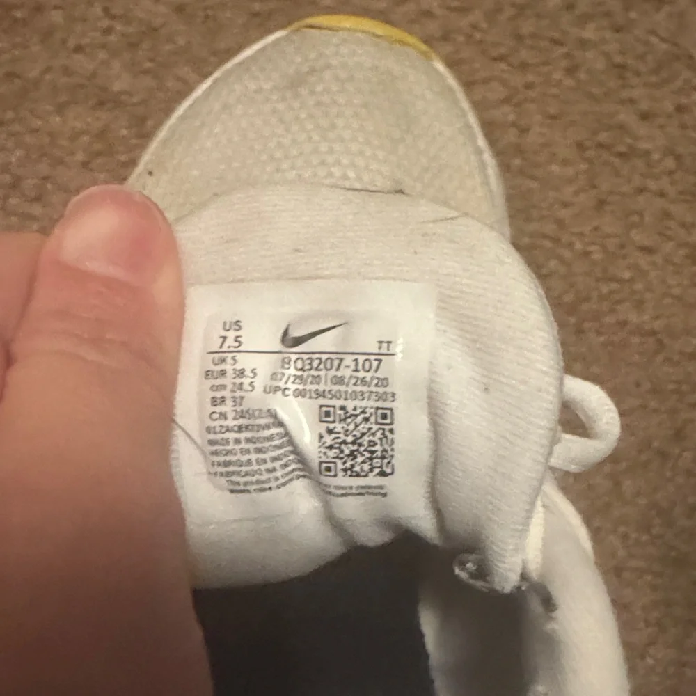 Nike White and Pink Sneakers with Yellow Accents